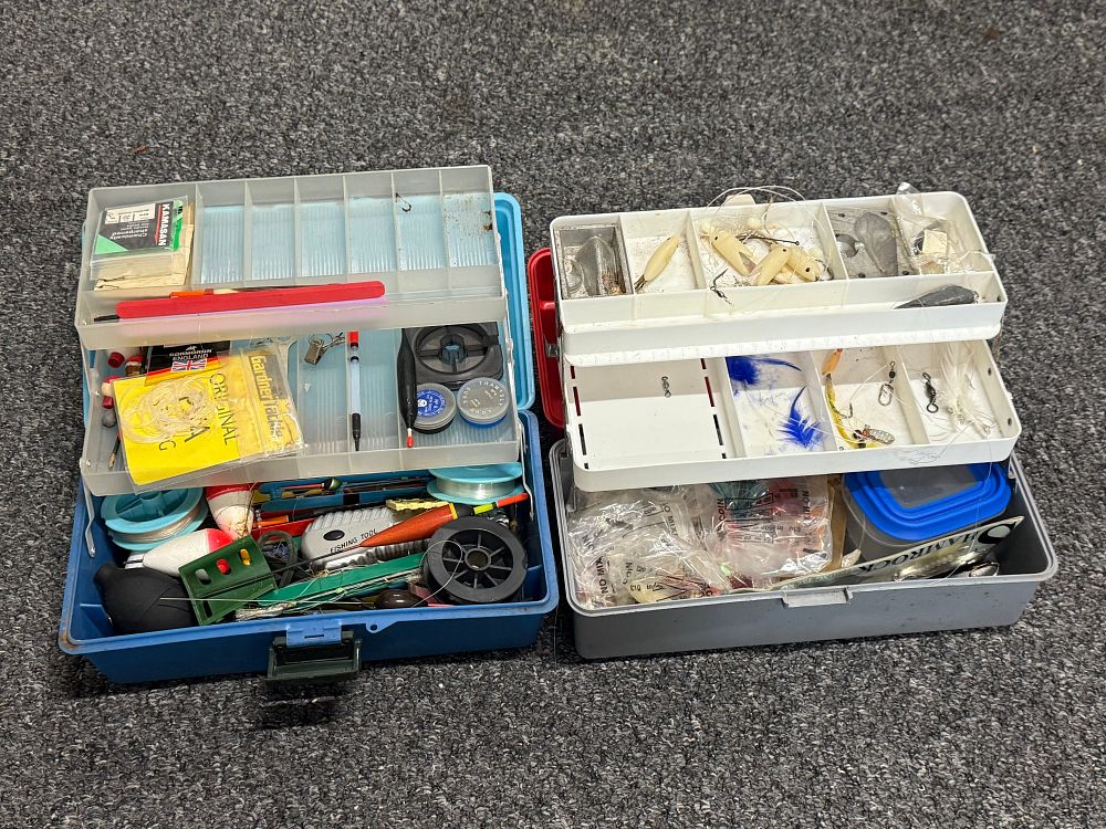 Lot 233: An assortment of fishing tackle in two cantilever tackle boxes