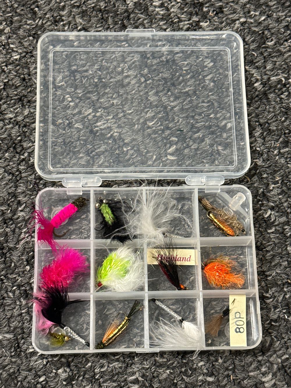 Lot 239: An assortment of Highland and mixed flies in a plastic box