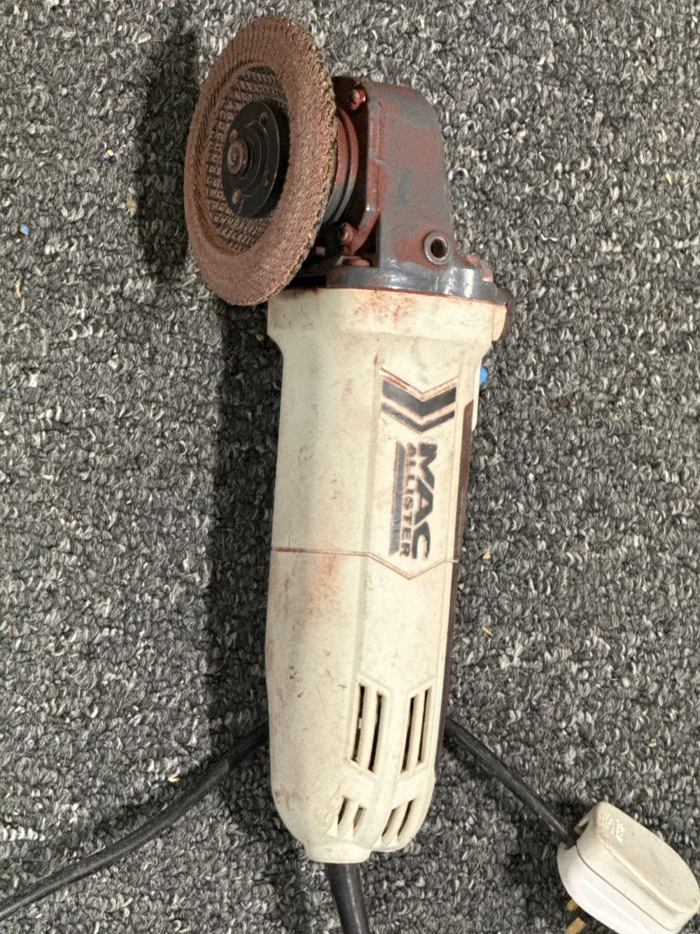 Lot 244: A Mac Allister corded electric angle grinder
