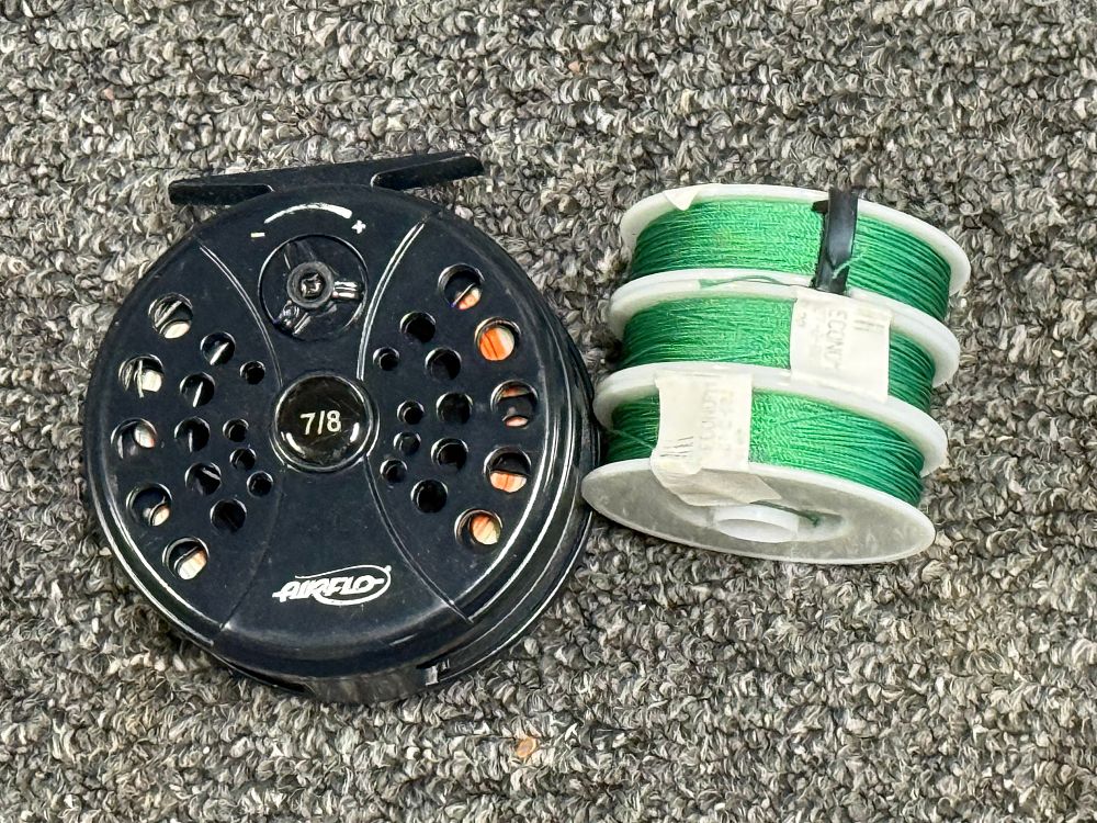 Lot 209a: An Airflo 7/8 fly fishing reel with three line spools