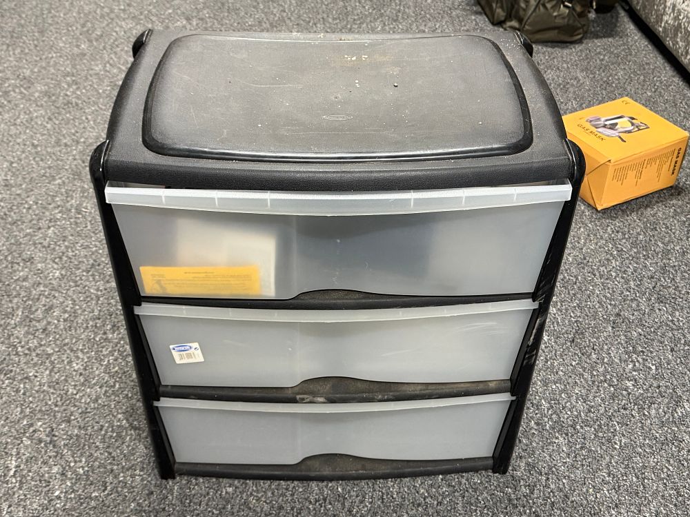 Lot 254: A Sterilite storage unit and associated items