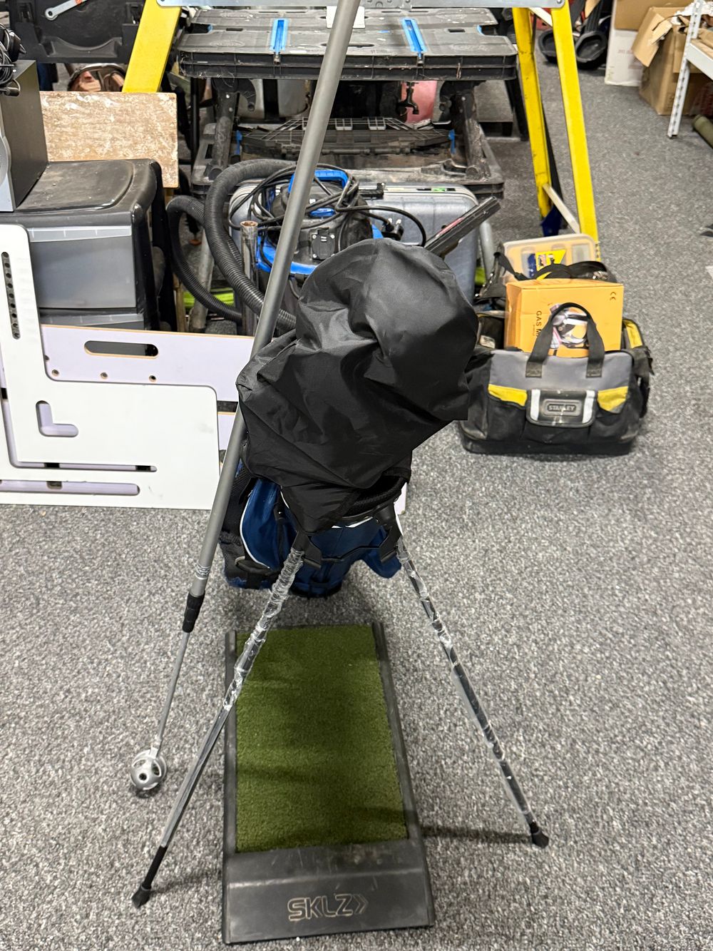 Lot 258: A collection of Feria junior golf clubs with stand bag and SKLZ mat