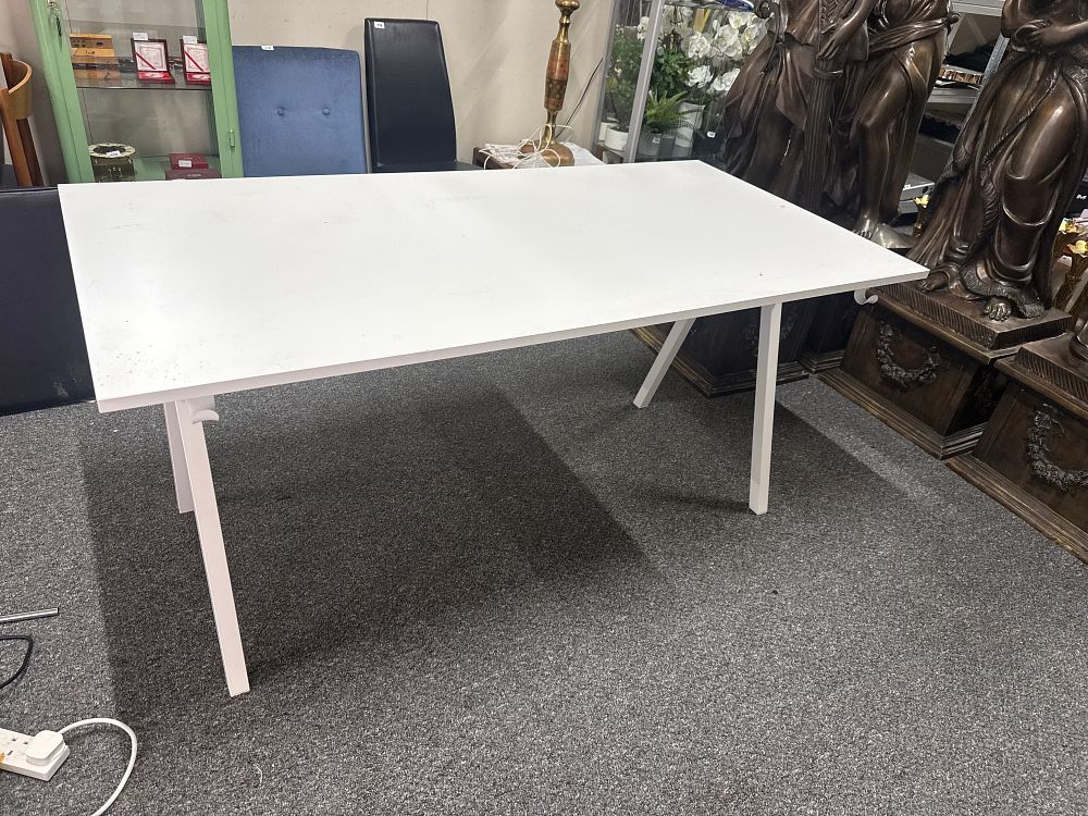 Lot 281: A minimalist white laminate rectangular work table with metal legs