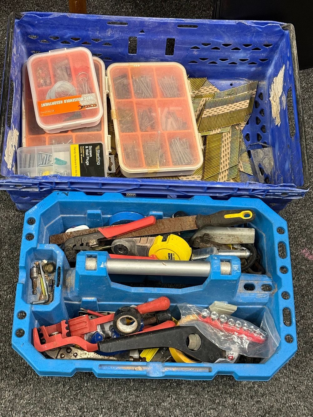 Lot 285: An assortment of hand tools, fasteners, and plastic storage crates