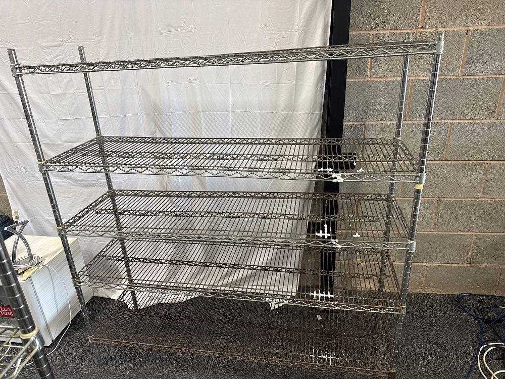 Lot 292: A used industrial five-tier chrome-plated wire shelving unit