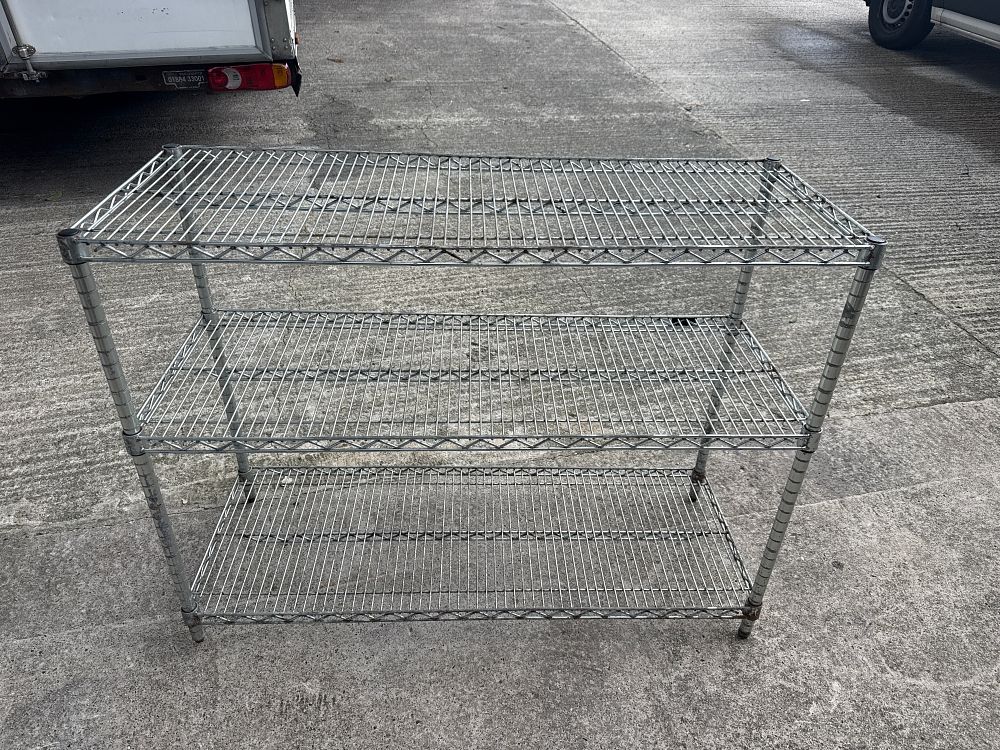 Lot 293: A three-tier industrial chrome finished wire shelving unit
