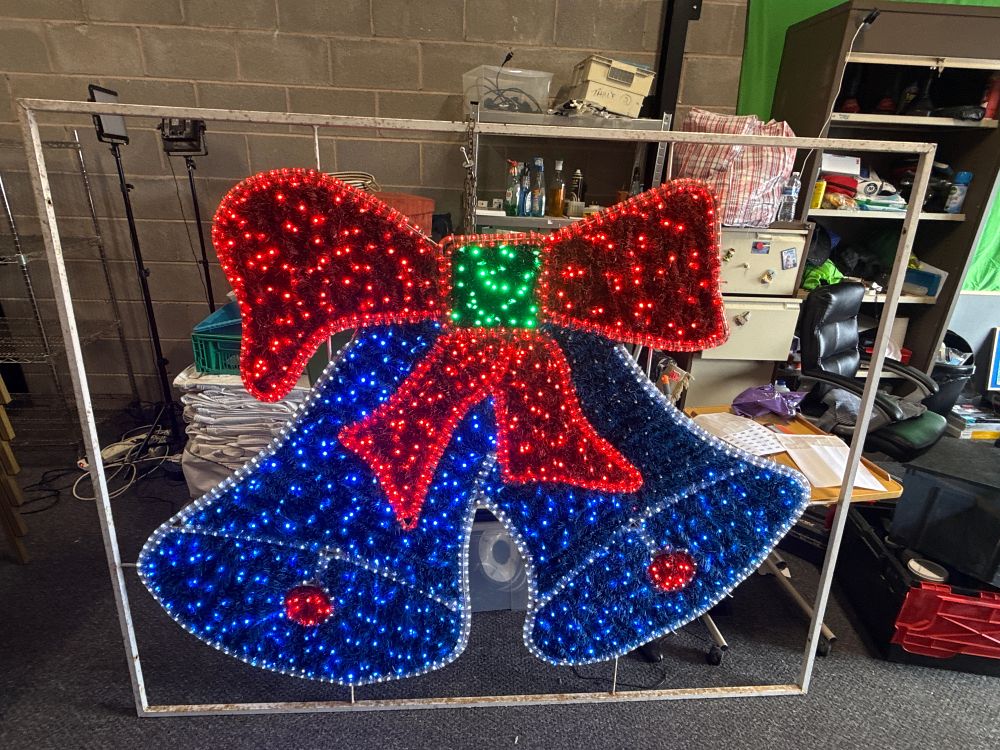 Lot 300: A large illuminated Christmas motif display featuring twin bells. Measures 63 inches high ( over 5ft)  and 79 inches wide