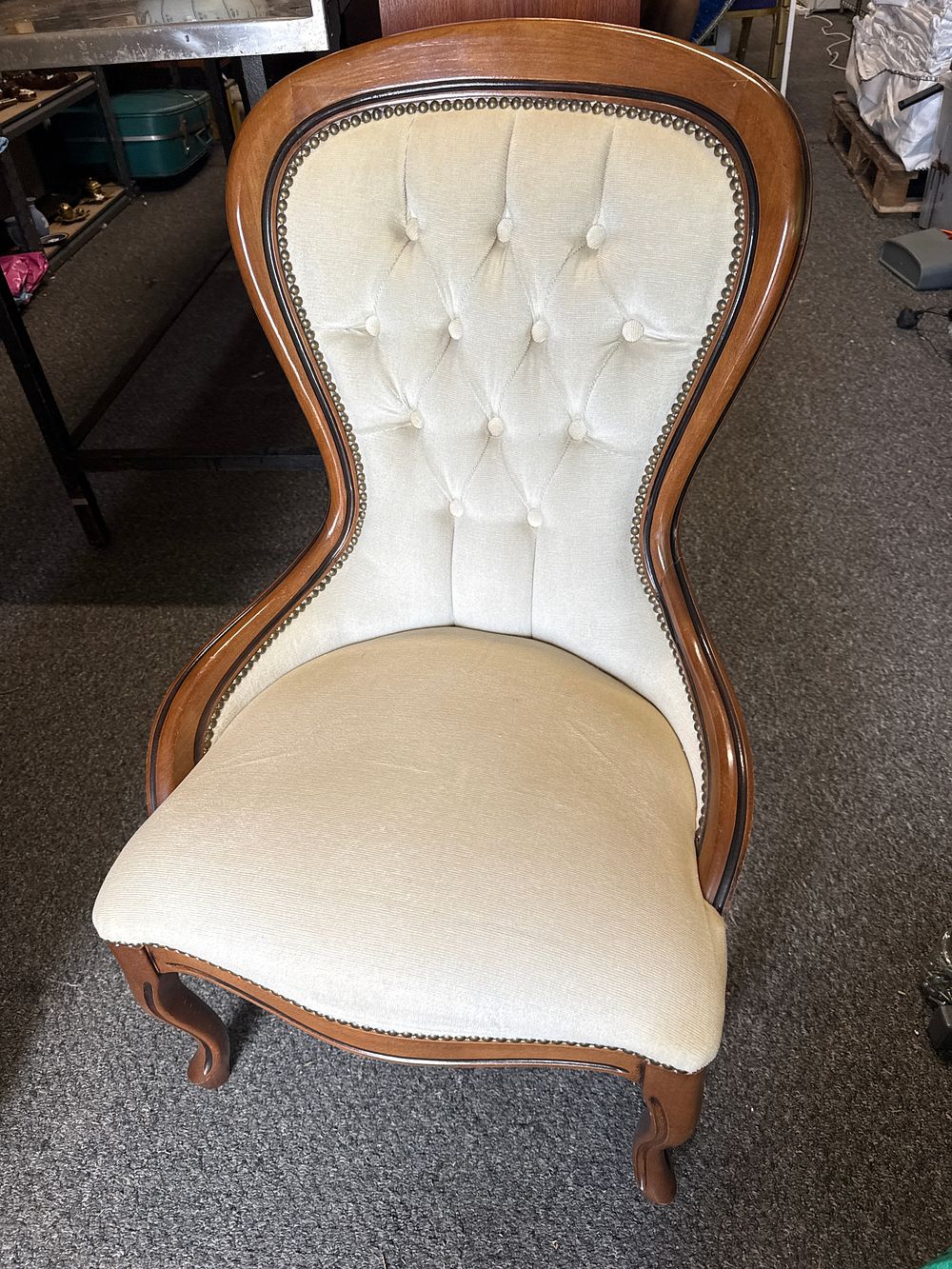 Lot 307: Victorian-style cream upholstered balloon-back nursing chair with cabriole legs
