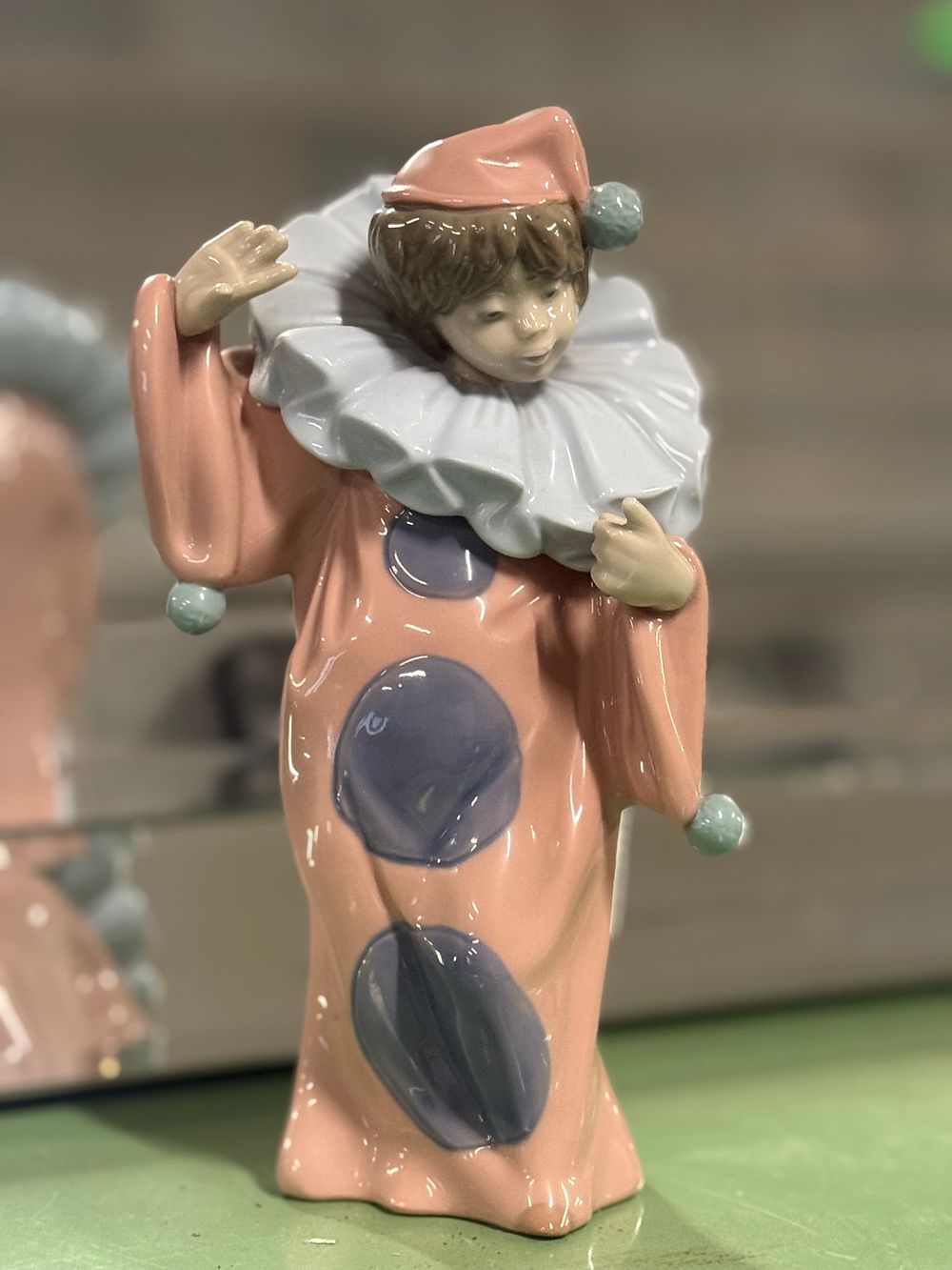 Lot 14: A Nao by Lladró porcelain figurine of a bashful clown