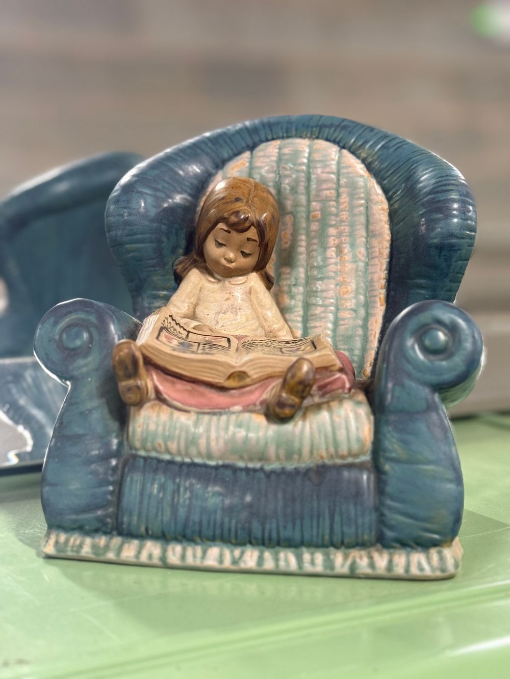 Lot 15: A NAO Spanish porcelain figurine of a girl reading