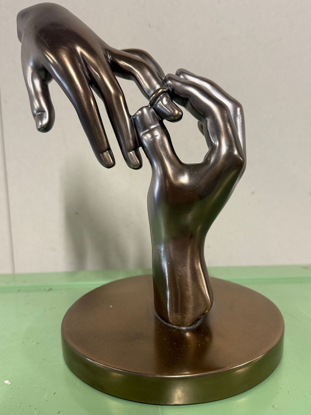 Lot 20: A bronze patinated sculpture of wedding hands