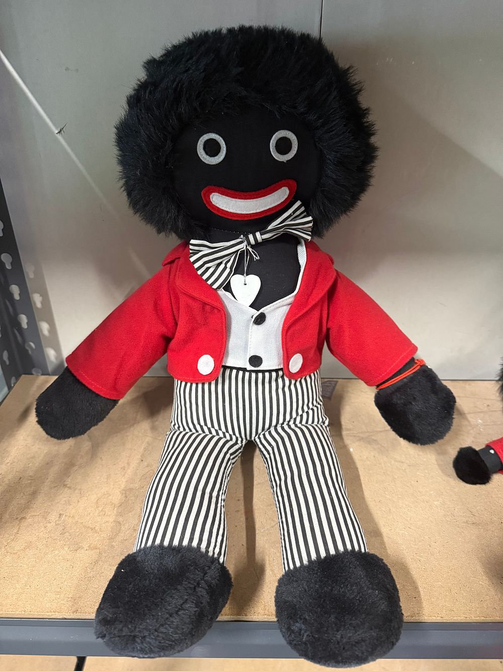 Lot 23: A plush twentieth-century soft-bodied golliwog memorabilia doll