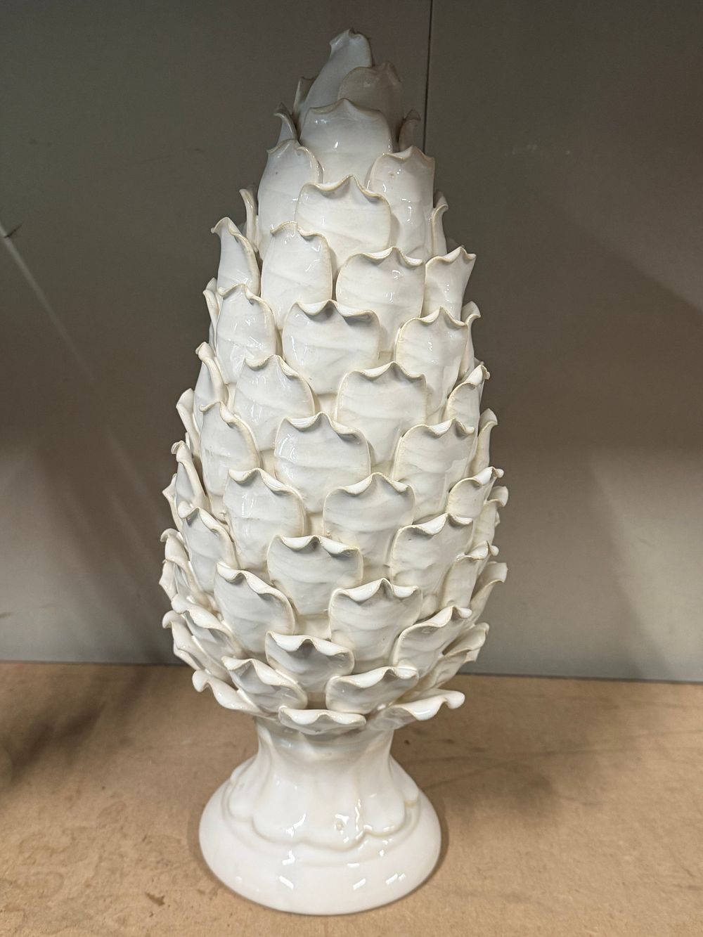 Lot 29: A large white glazed ceramic pinecone decorative ornament