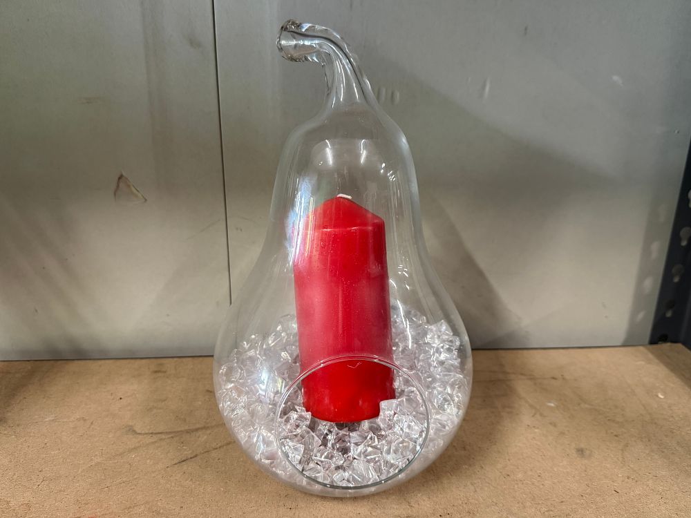 Lot 34: A pear-shaped clear glass candle holder with faux-ice crystals