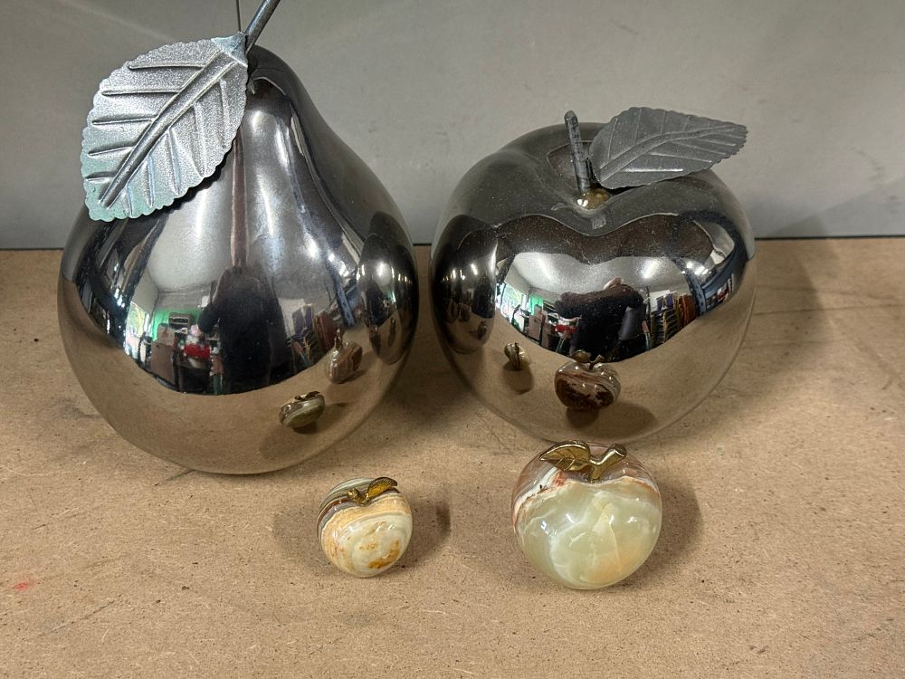 Lot 35: A collection of chrome-toned metal and banded onyx decorative fruit