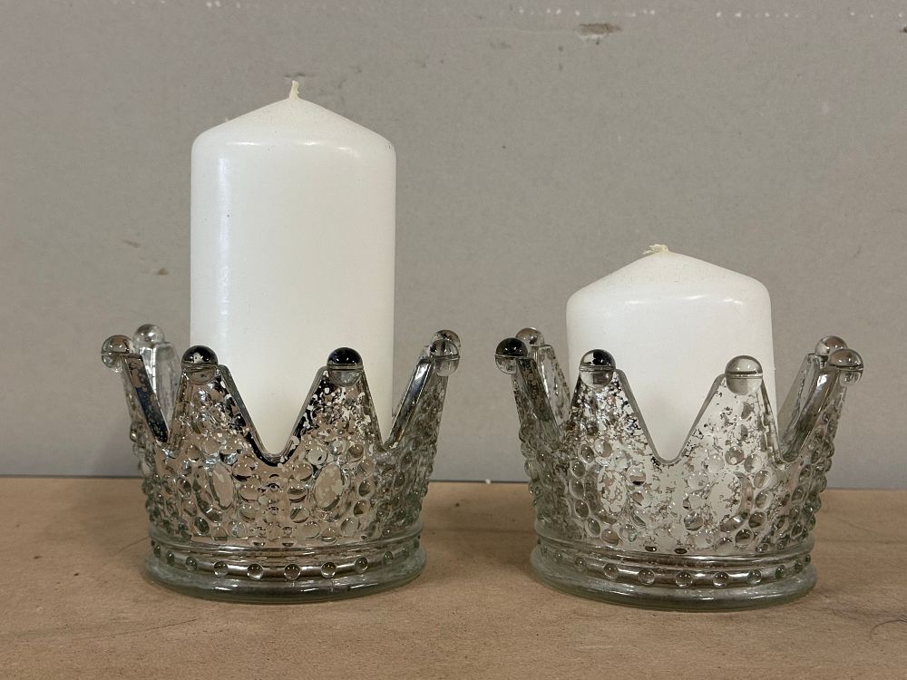 Lot 45: A pair of crown shaped mercury glass pillar candle holders witb candles