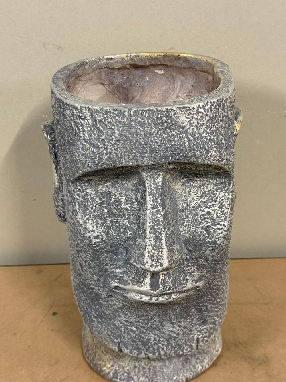 Lot 54: A cast composite Moai head figural planter