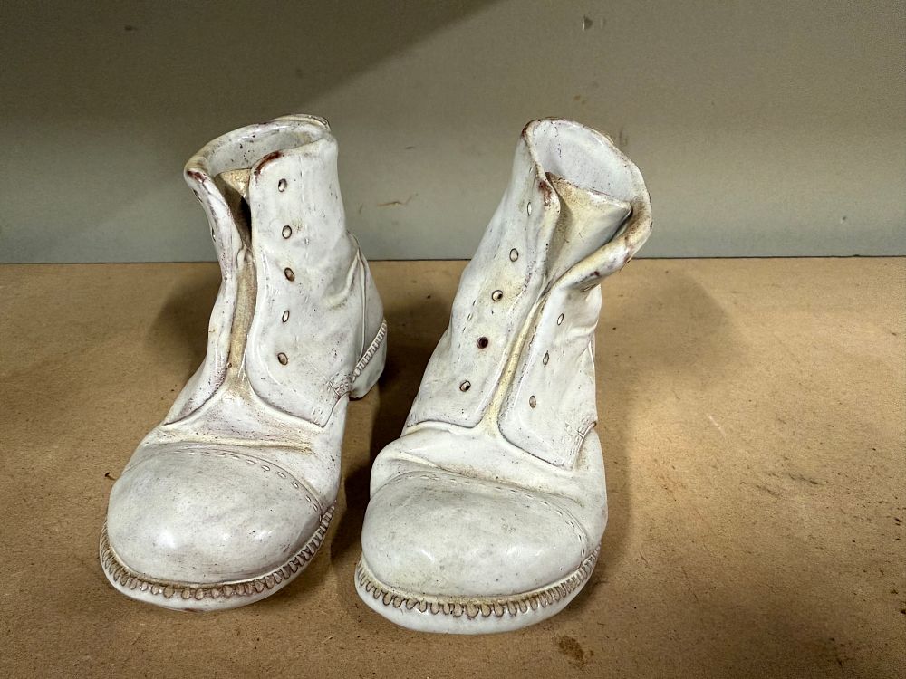 Lot 60: A pair of realistic Gaqqufa Malta ceramic boot figurines