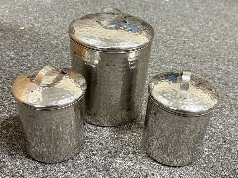 Lot 76: A Trio of Hammered Stainless Steel Kitchen Canisters