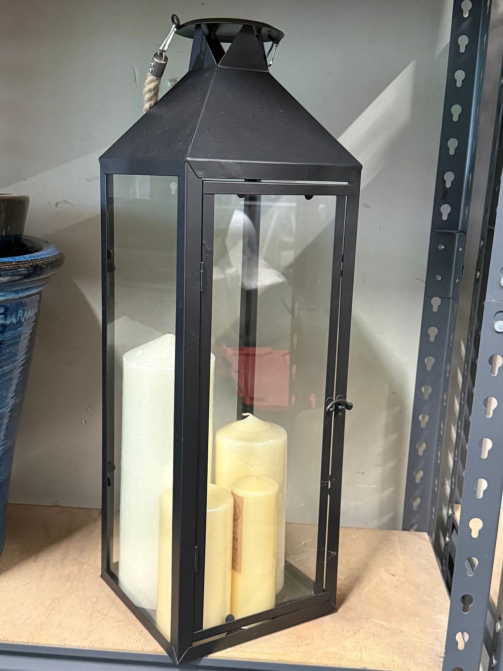 Lot 78: A black metal and glass candle lantern