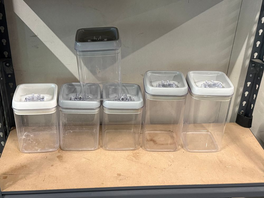 Lot 81: A set of six clear acrylic airtight food storage containers