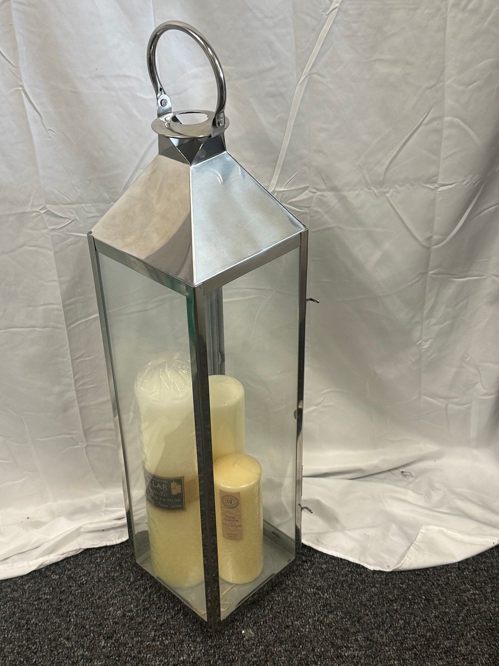 Lot 82: A polished chrome and glass floor lantern