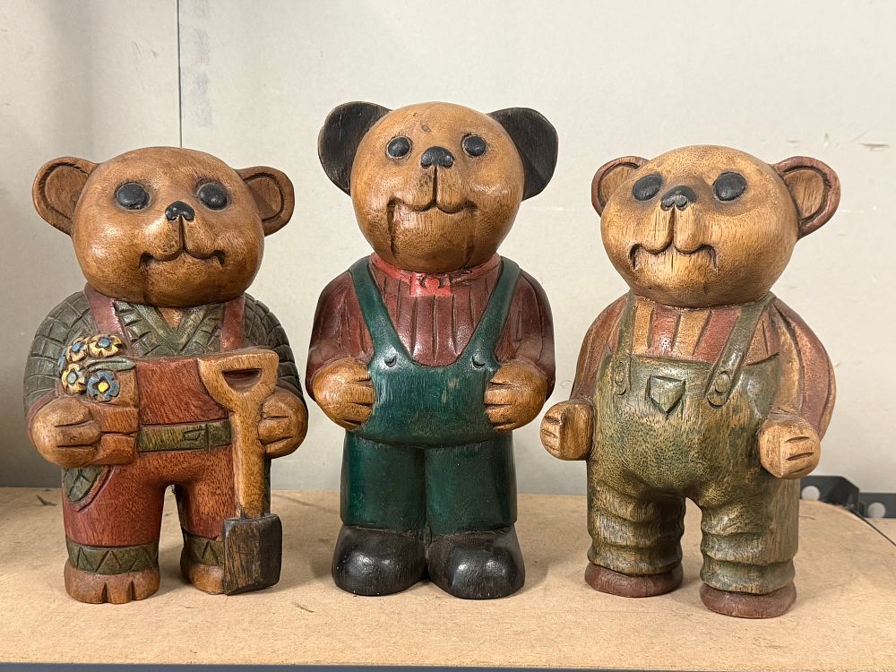 Lot 83: A trio of carved and painted wooden teddy bear figurines