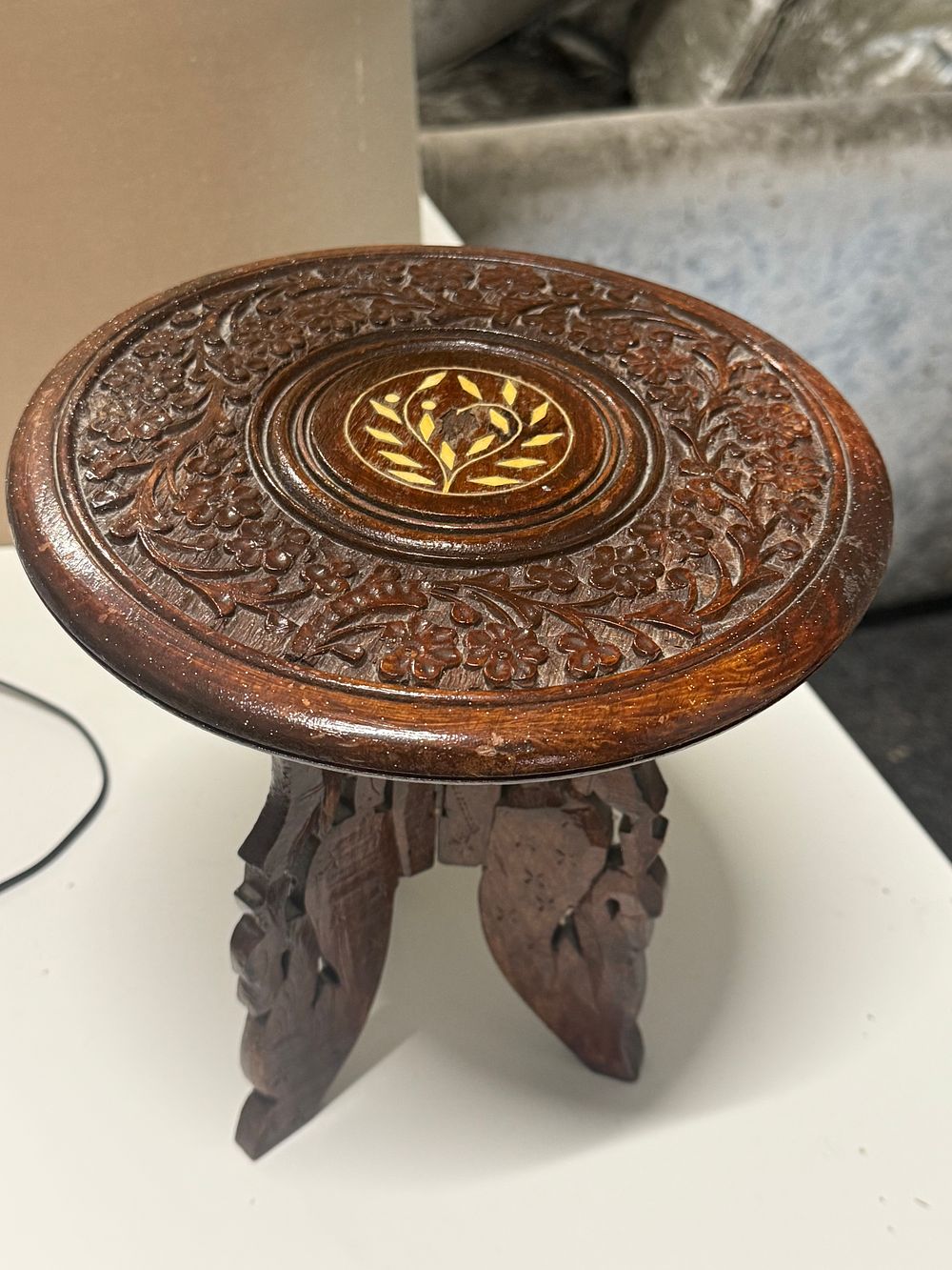 Lot 84: Anglo-Indian carved wood folding tripod side table