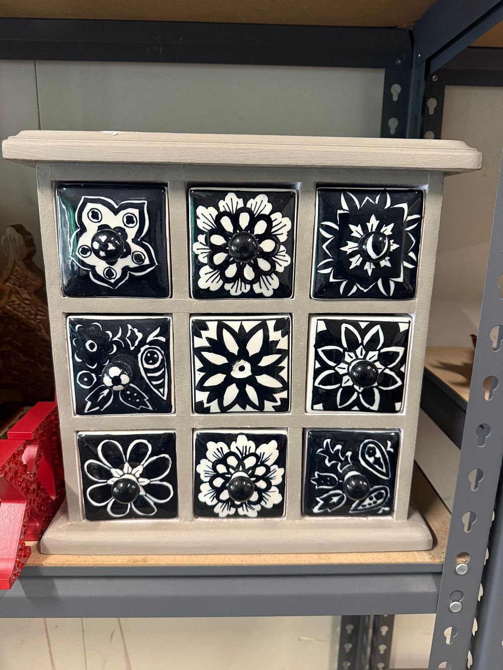Lot 88: A wooden nine drawer spice chest with ceramic tiles