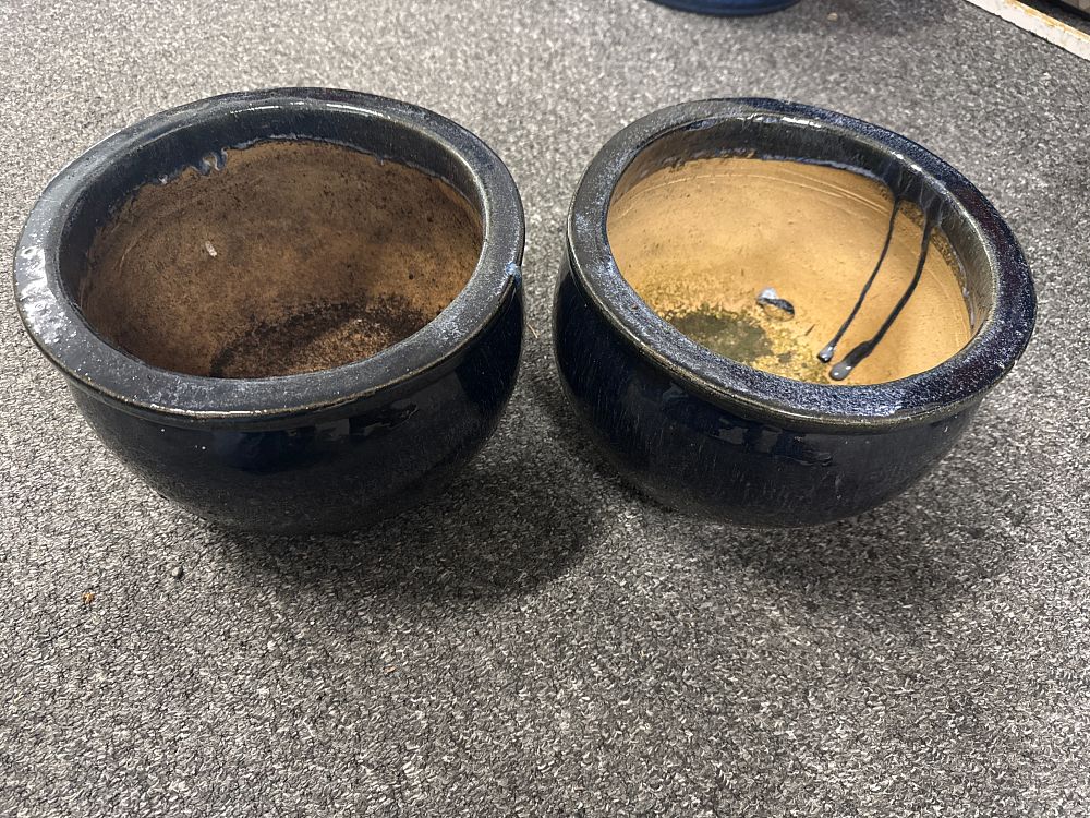 Lot 98: A pair of navy blue glazed ceramic planters