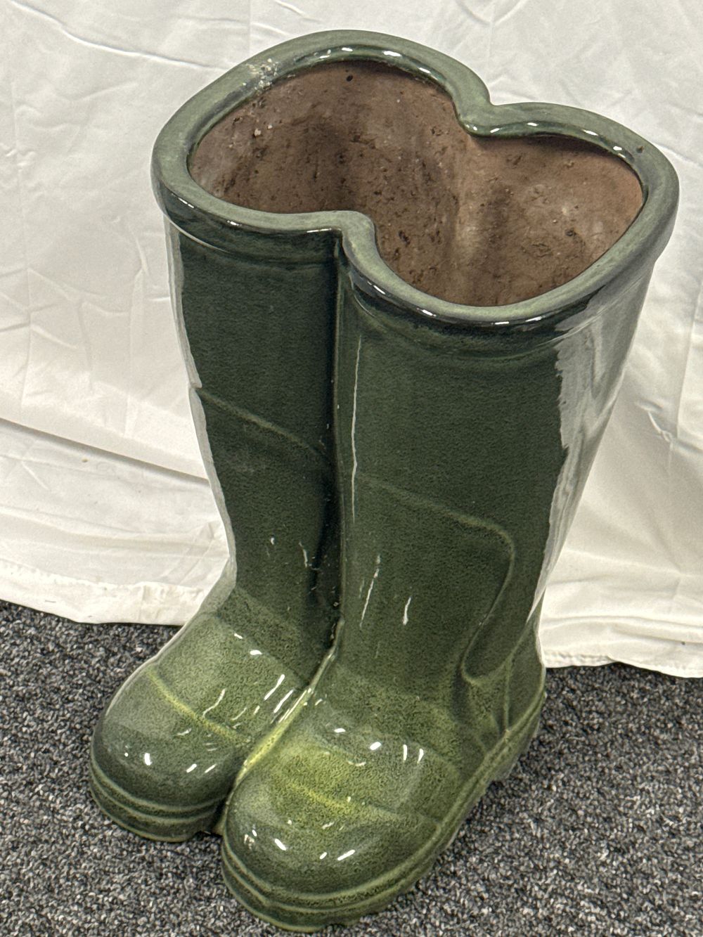 Lot 105: A large green glazed ceramic Wellington boot garden planter