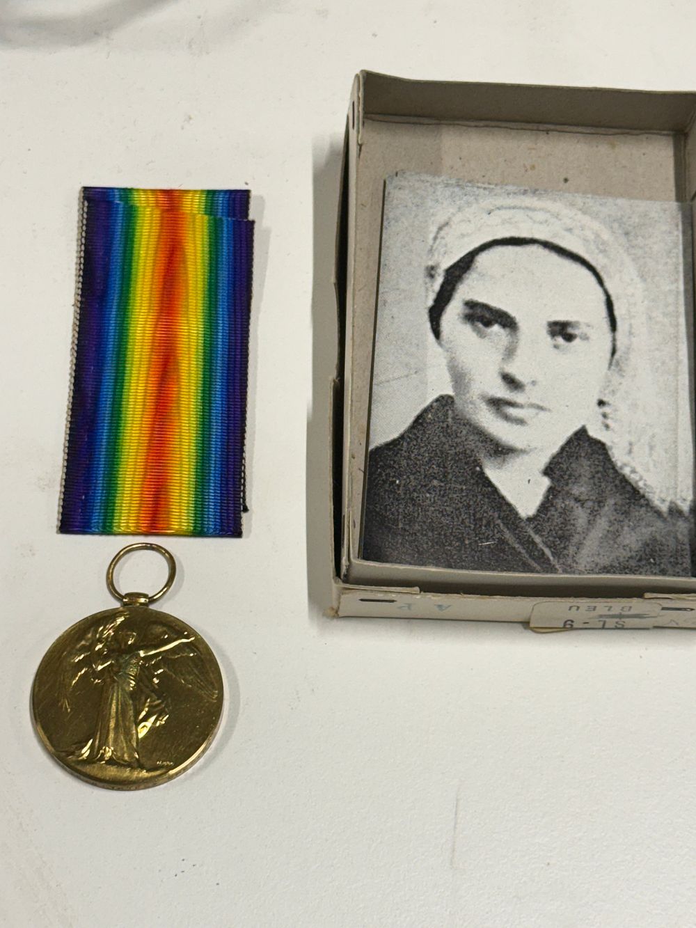 Lot 118: A British World War I Victory Medal with ribbon and portrait photograph
