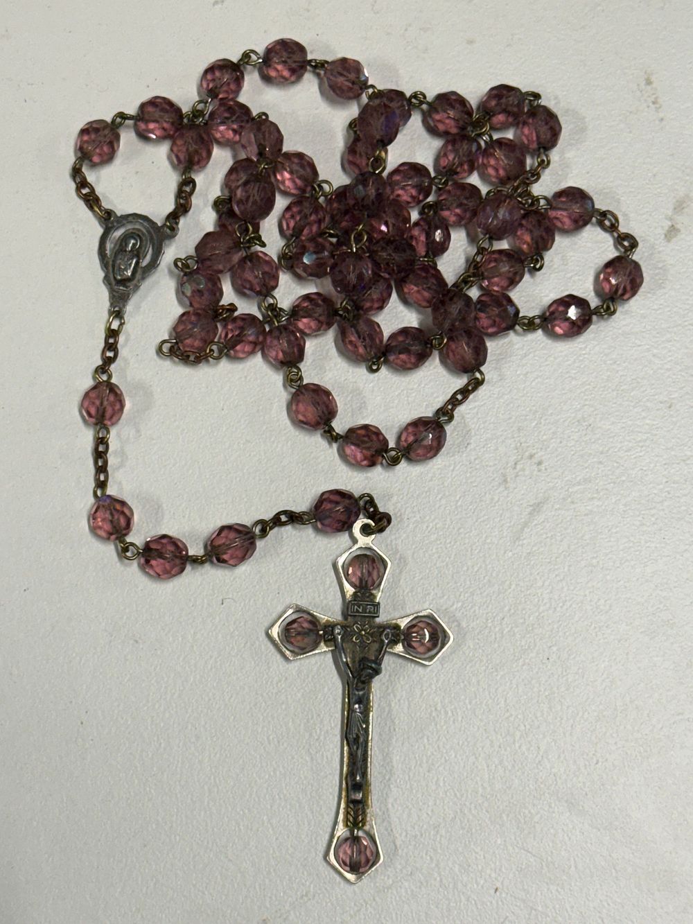 Lot 120: A faceted amethyst glass bead rosary with book form presentation box