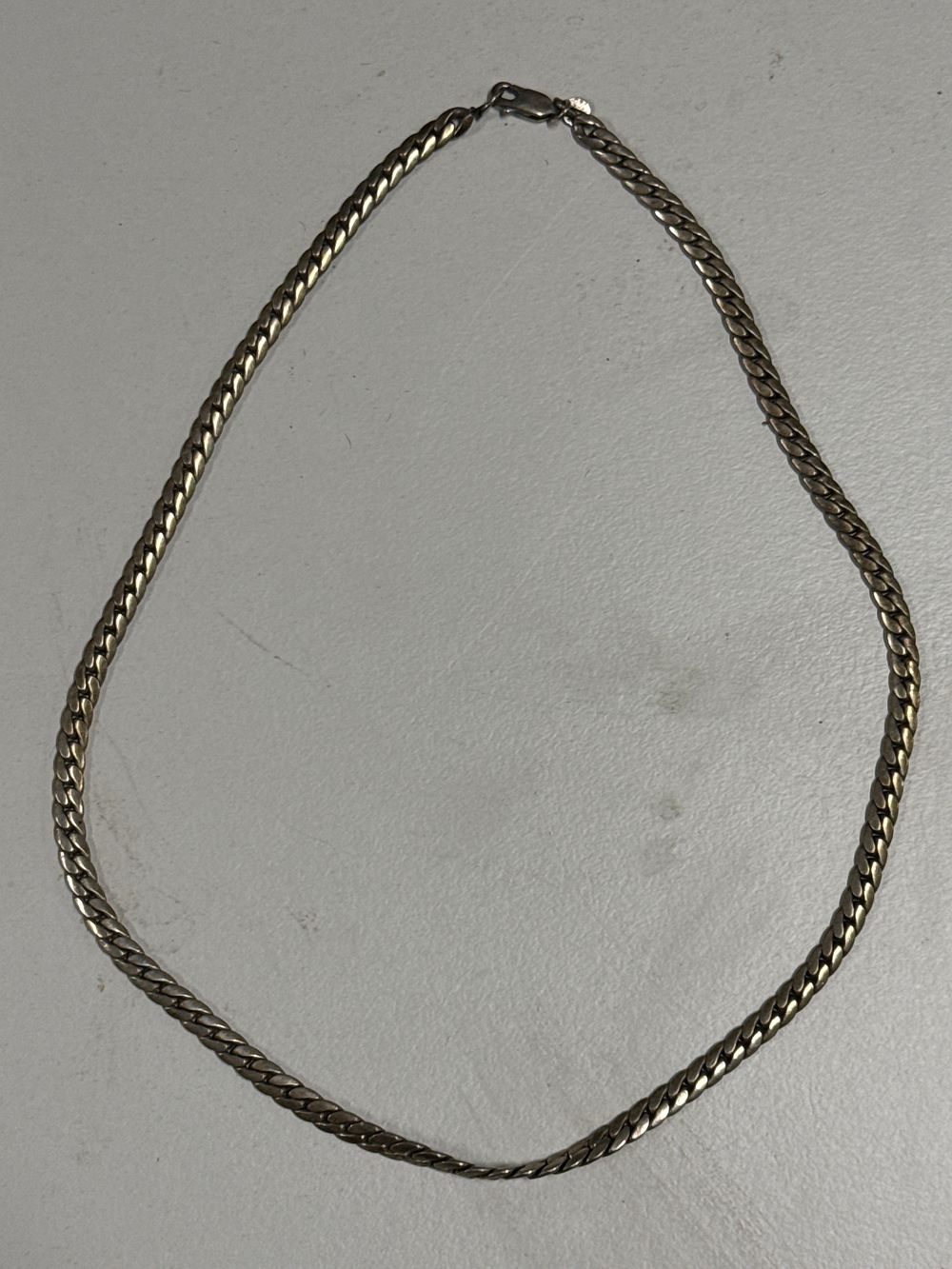 Lot 125: A sterling silver curb link chain necklace 17.4 Grams
