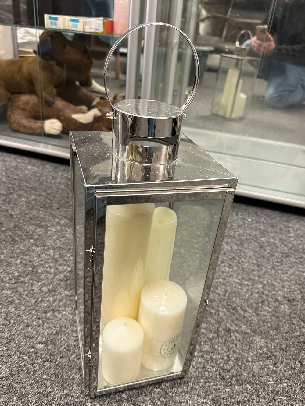 Lot 140: A large polished silver-tone metal and glass floor lantern