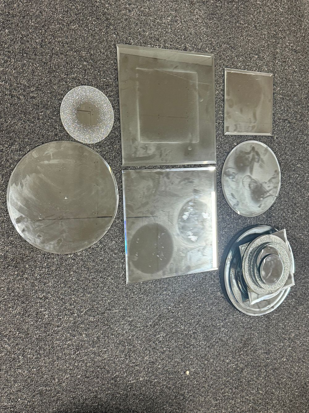 Lot 151: An assortment of beveled and decorative glass mirror plates