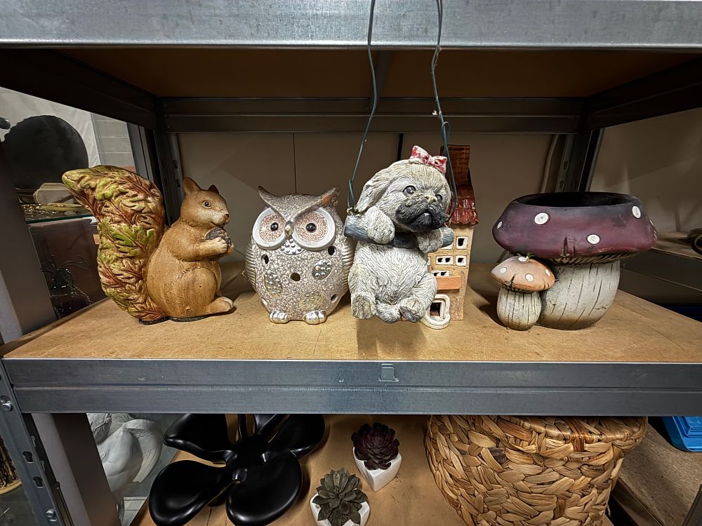 Lot 153: An assortment of ceramic and resin garden ornaments and planters