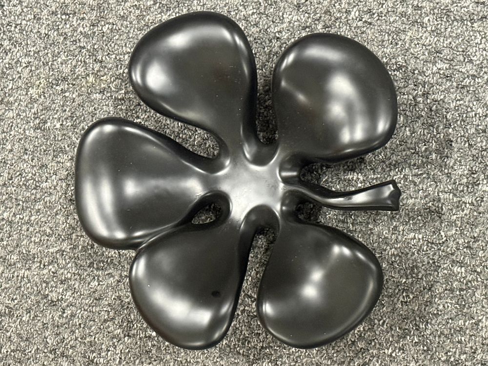 Lot 155: A contemporary five pointed leaf black matte organic decorative dish