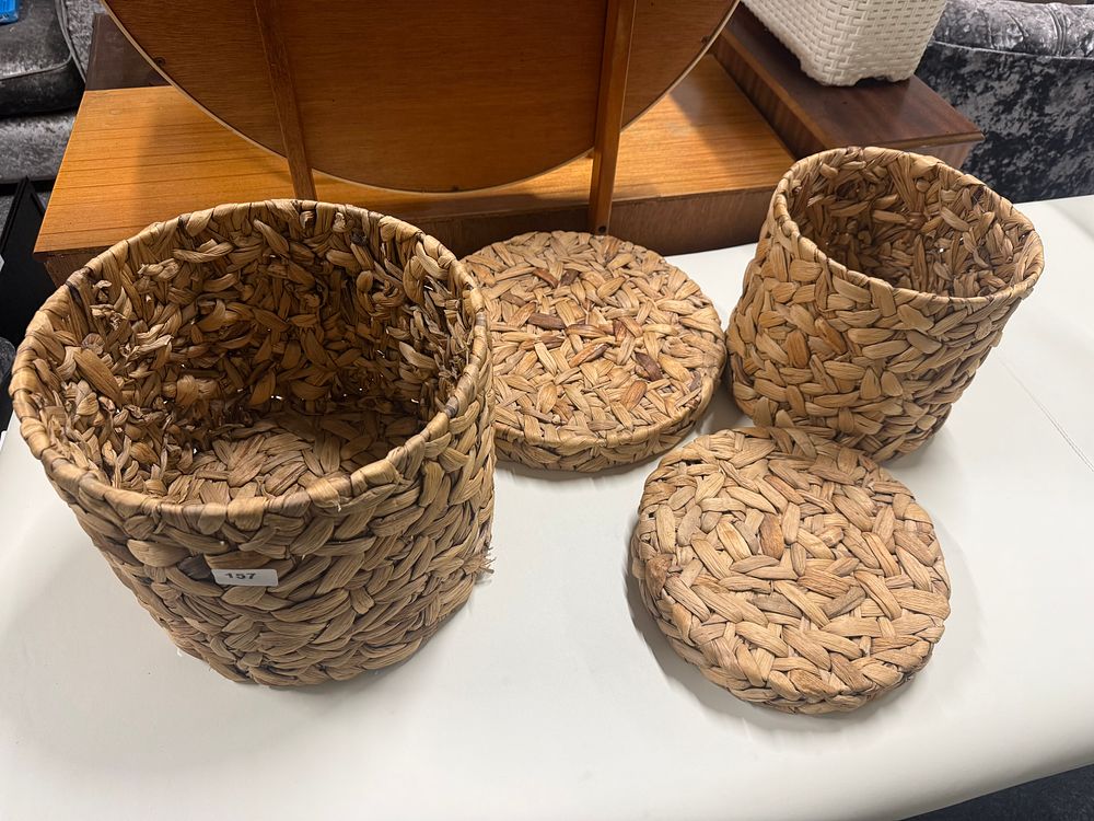 Lot 157: A pair of natural woven nesting baskets, Largest is 14" Diameter and 11" Tall
