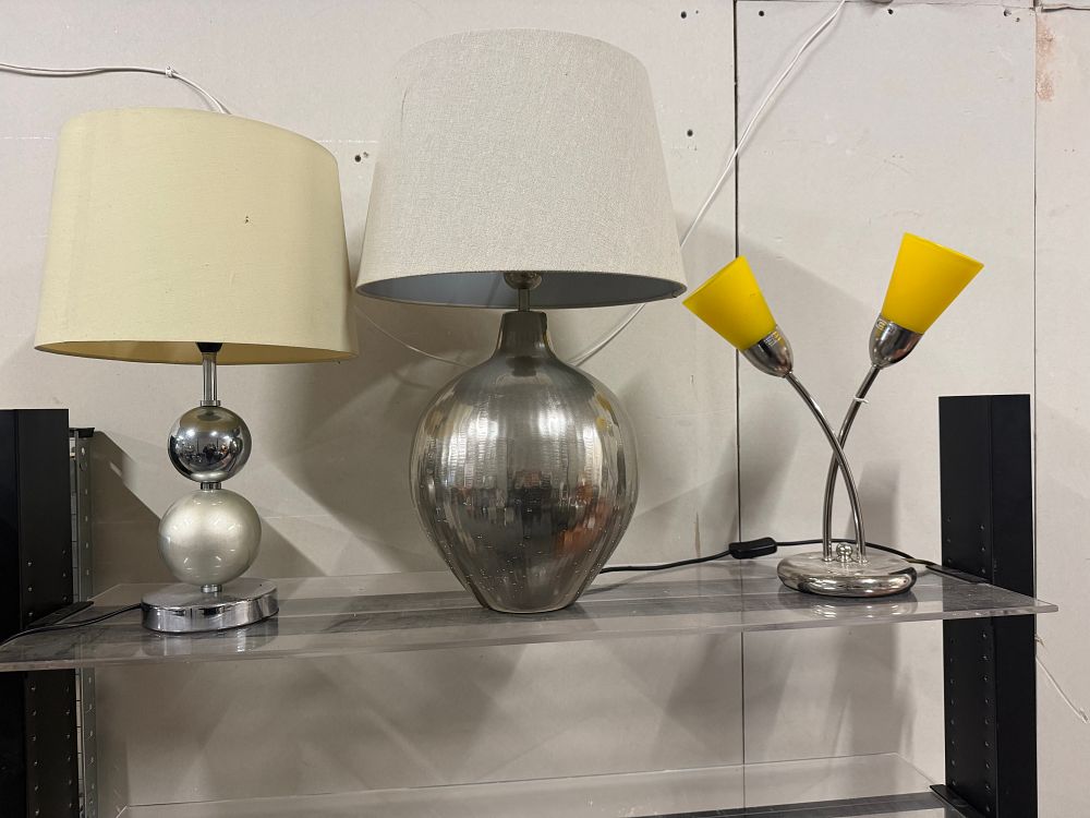 Lot 159: A trio of contemporary polished metal and glass table lamps