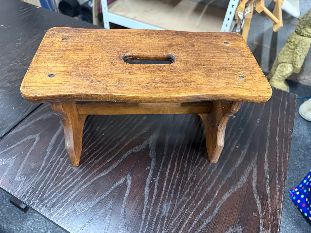 Lot 163: A rustic vintage wooden step stool with carrying handle