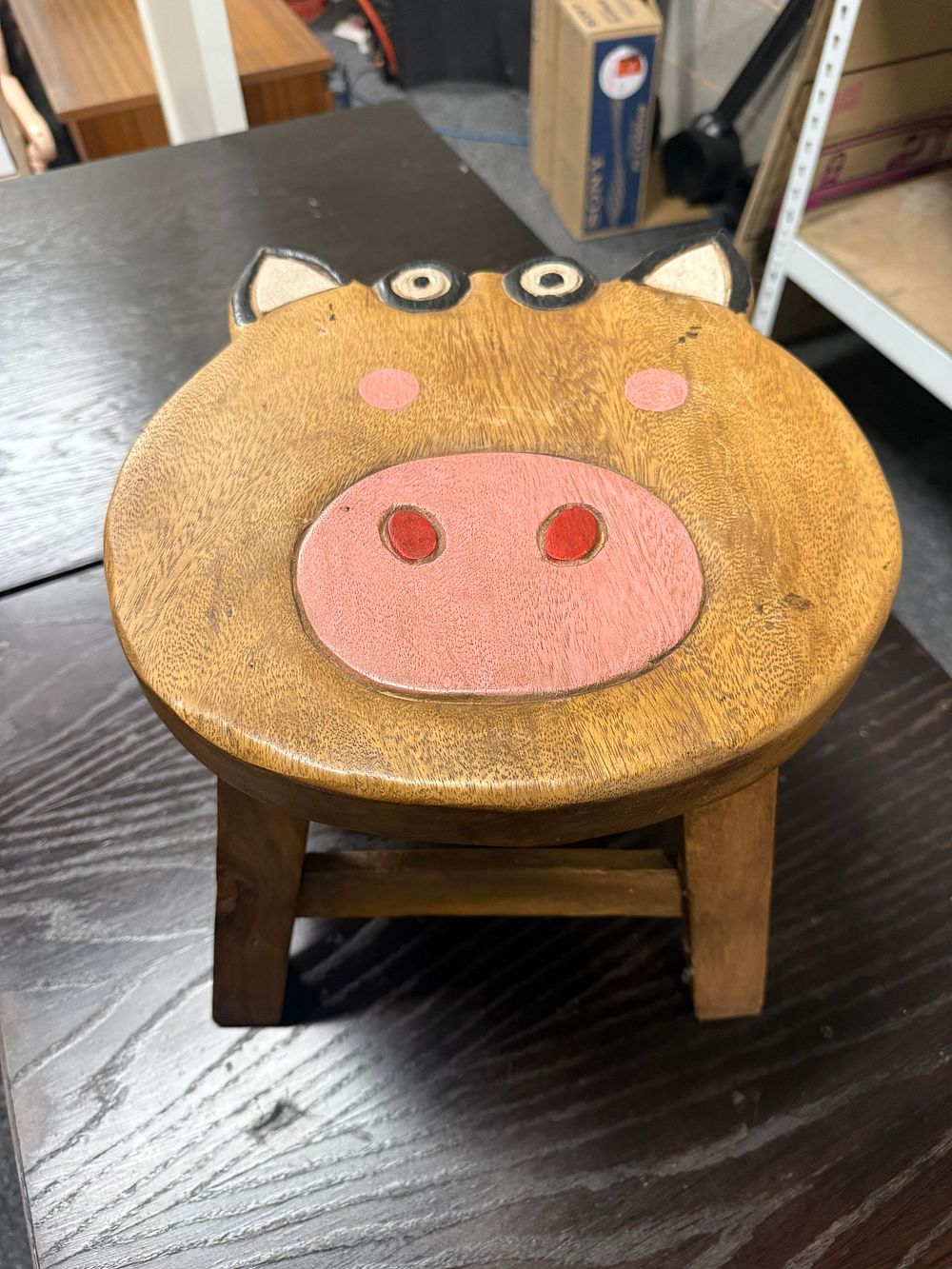 Lot 164: Hand-carved solid wood childs pig motif stool