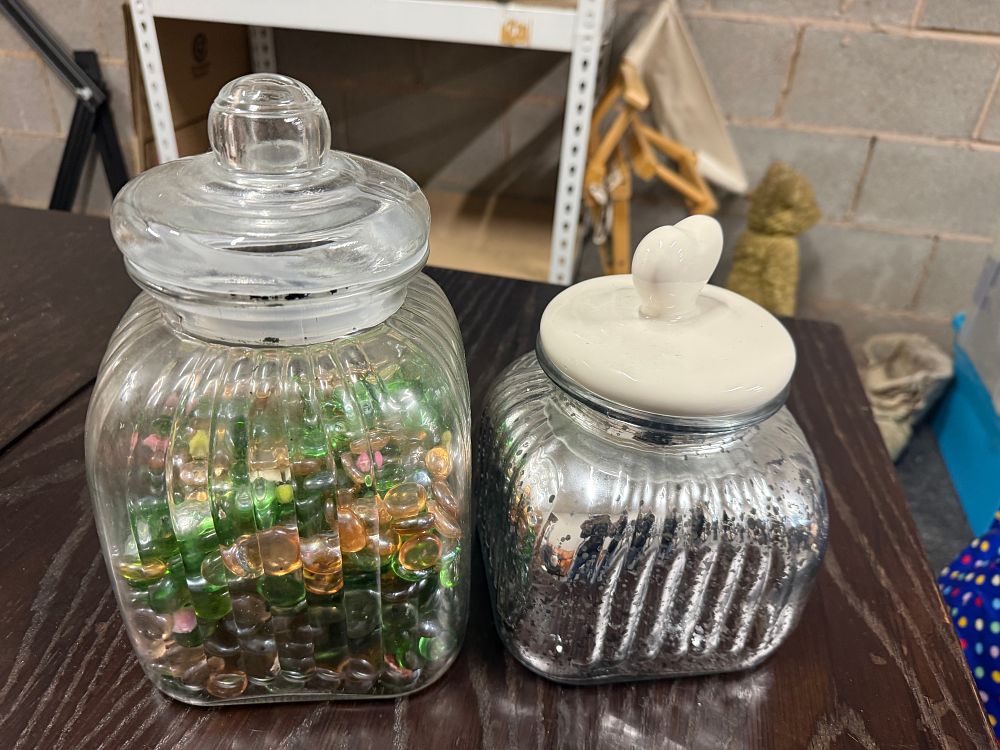 Lot 165: Two Large ribbed glass storage jars with decorative lids