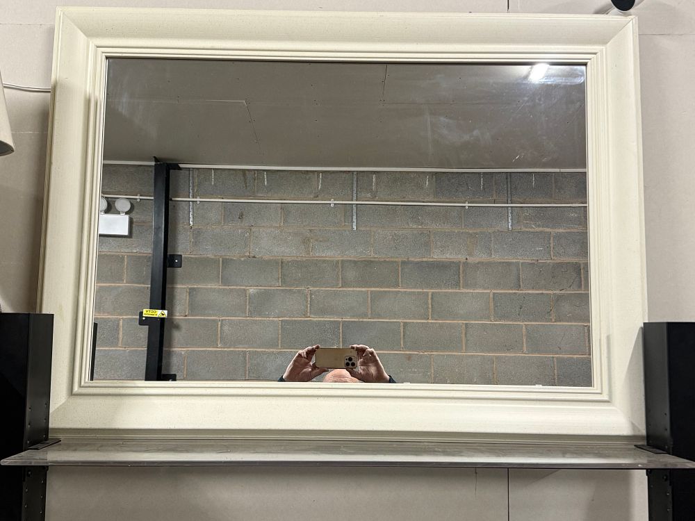 Lot 168: A large rectangular wall mirror in an off-white molded frame