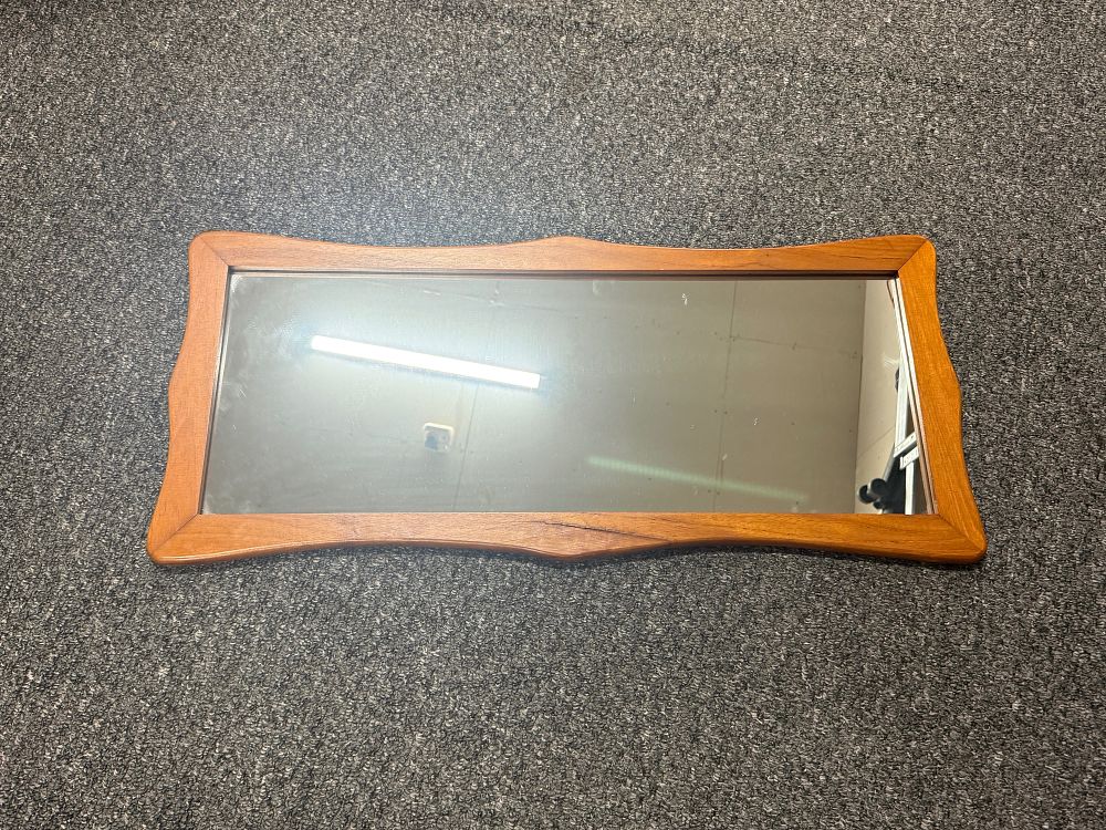 Lot 174: A Mid-Century Modern curved wooden wall mirror