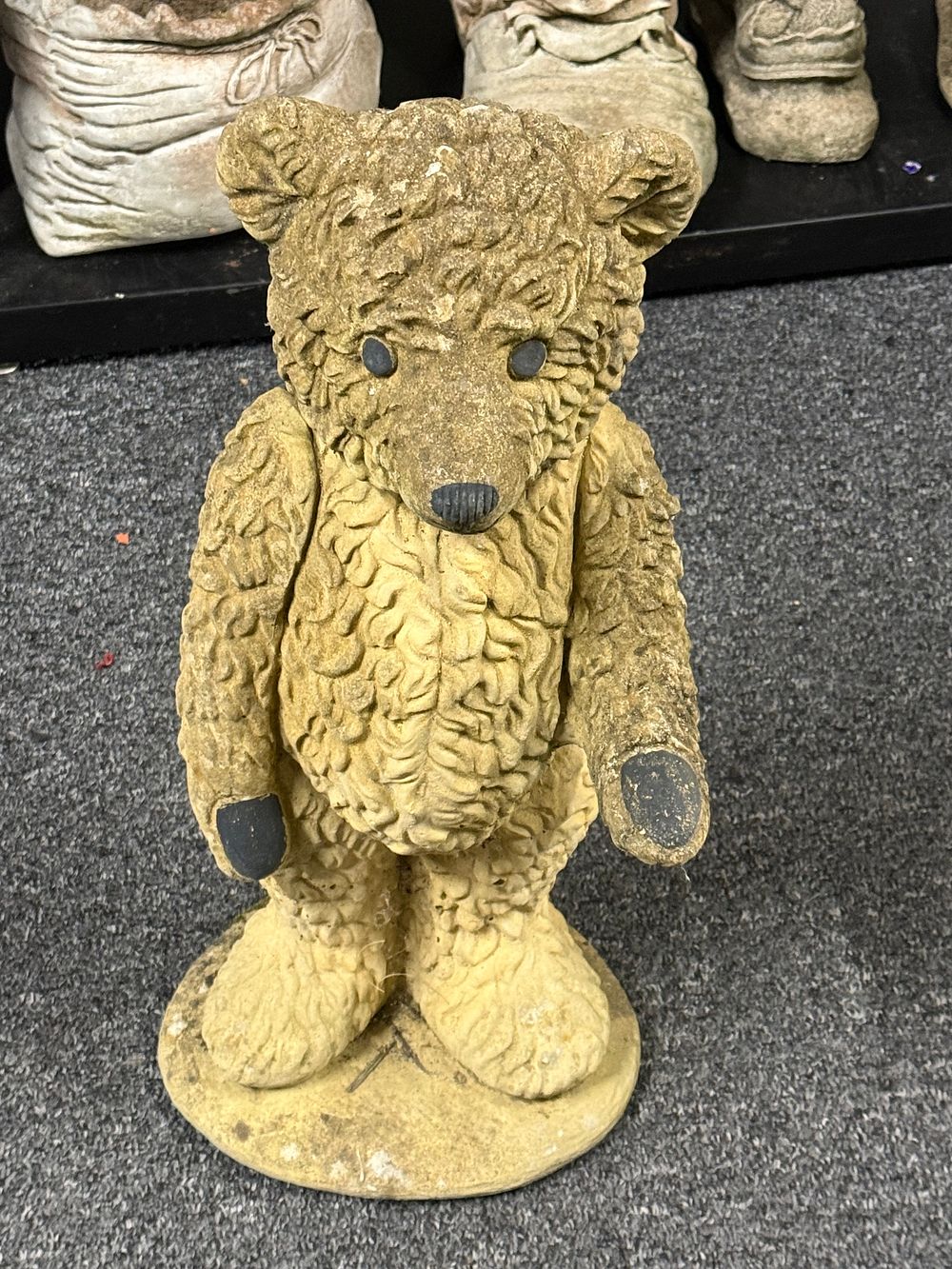 Lot 178: A cast stone garden statue of a standing teddy bear