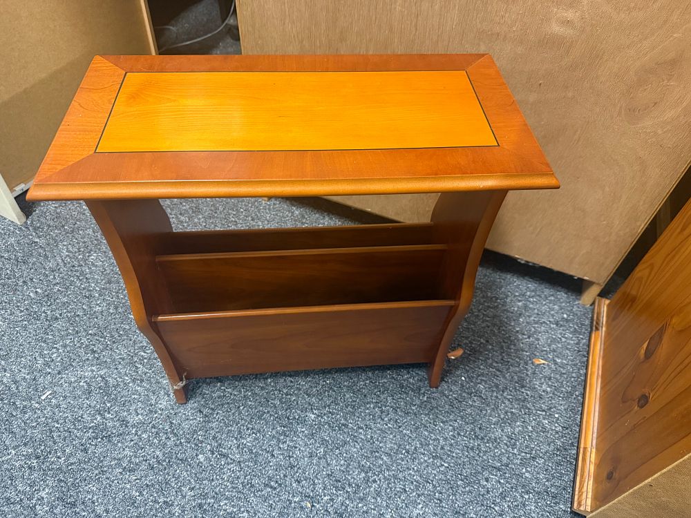 Lot 180: A contemporary two-tone wood side table and magazine rack