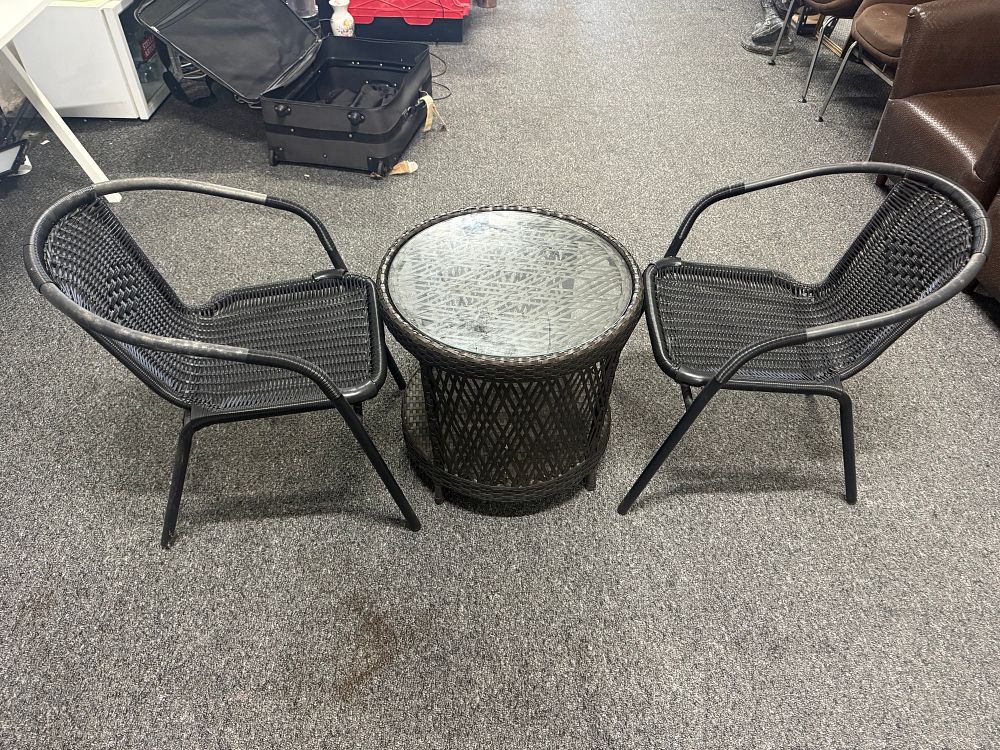 Lot 184: A three piece synthetic wicker and glass bistro set