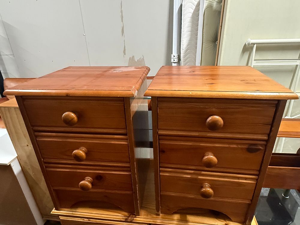 Lot 190: A pair of rustic pine three drawer bedside chests