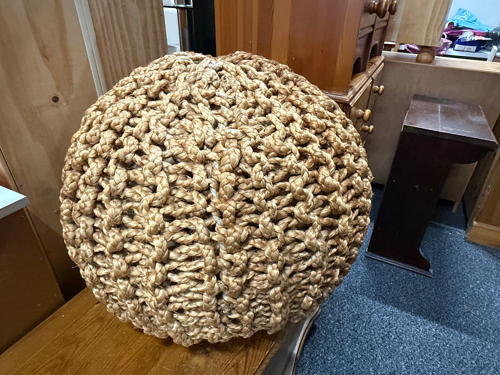 Lot 193: A large spherical woven jute pouffe or floor cushion